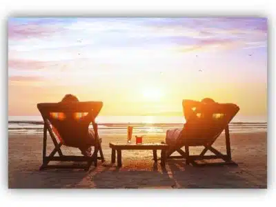 Two people relaxing on the beach and living the So Cal Beach Lifestyle