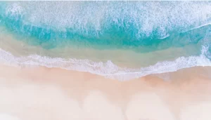 Luxury Real Estate waves crashing on the beach